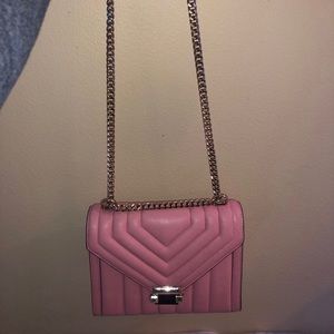 I am selling a pink Michael Kors handbag.
